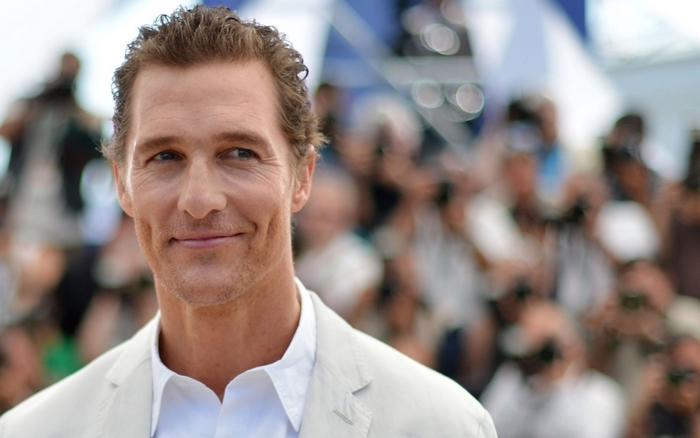 Matthew McConaughey smiling outdoors