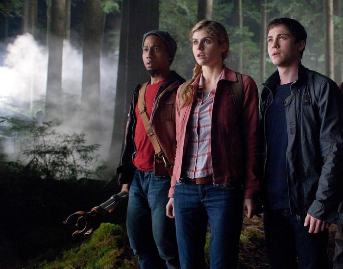 Alexandra Daddario and two men in a forest