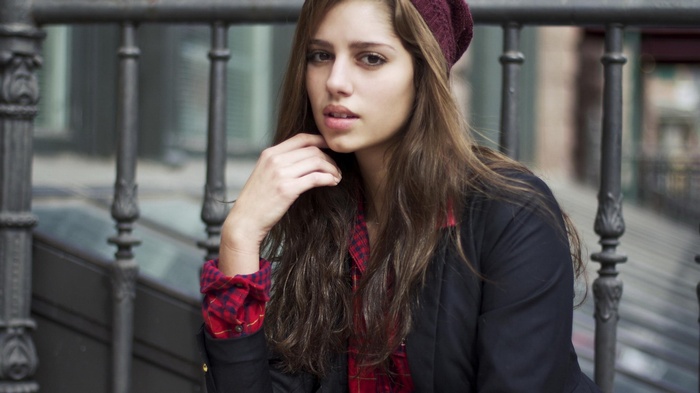 Young woman wearing a beanie and jacket