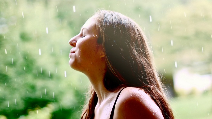 Woman enjoying the rain