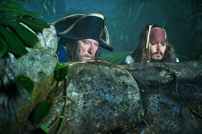 Captain Barbossa and Jack Sparrow from Pirates of the Caribbean hiding