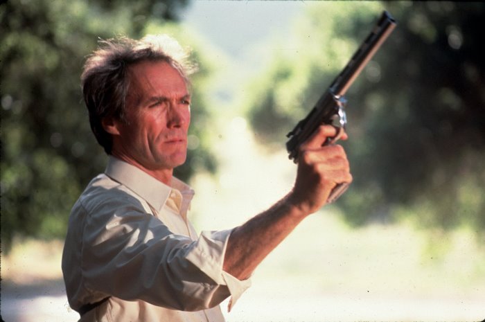 Clint Eastwood holding a gun
