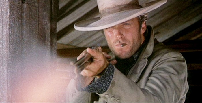Clint Eastwood firing a gun