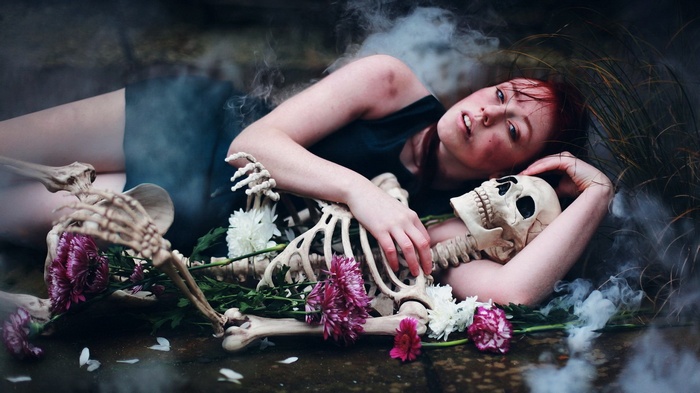 Woman with skeleton and flowers