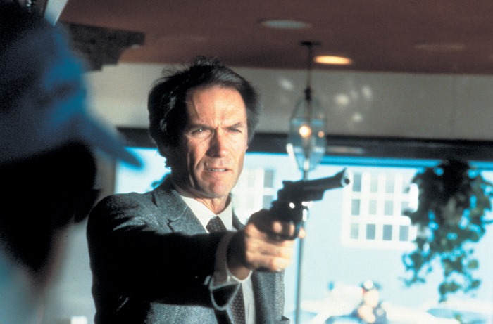 Clint Eastwood holding a gun