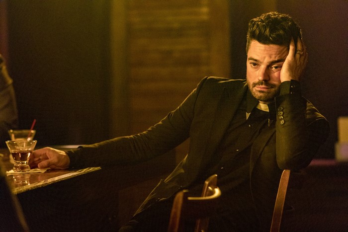 Dominic Cooper in a dark bar