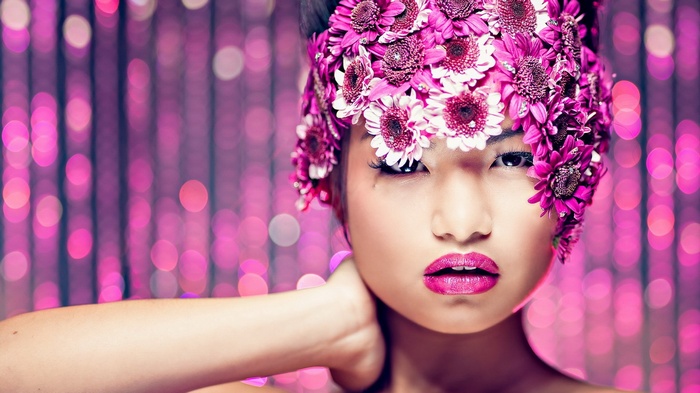 Woman with pink flowers on her head