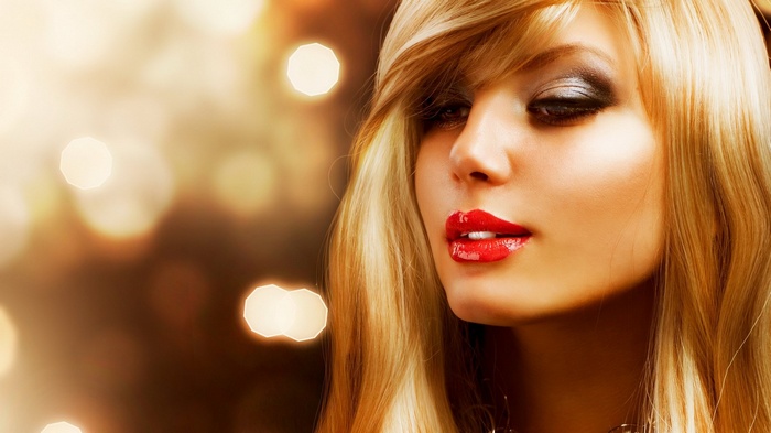 Woman with blonde hair and red lipstick
