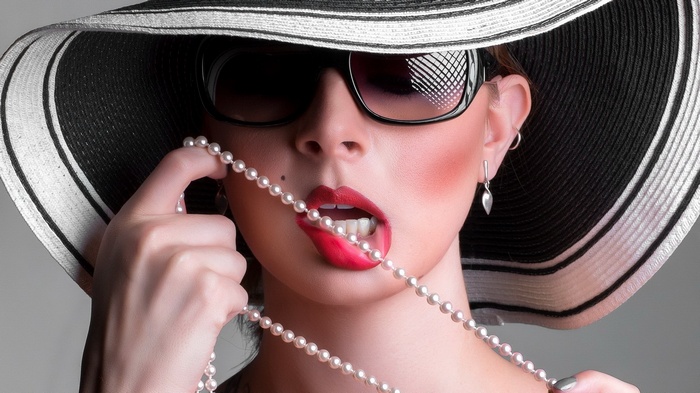 Woman in Hat and Sunglasses with Pearls