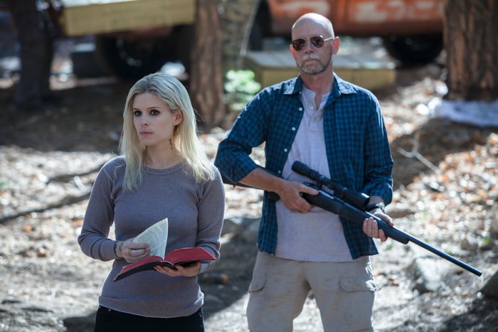 Kate Mara and man with rifle