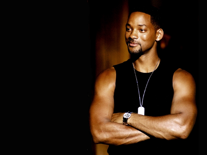 Will Smith wearing a black tank top and dog tag necklace