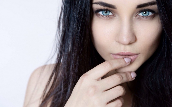 Woman with blue eyes and dark hair