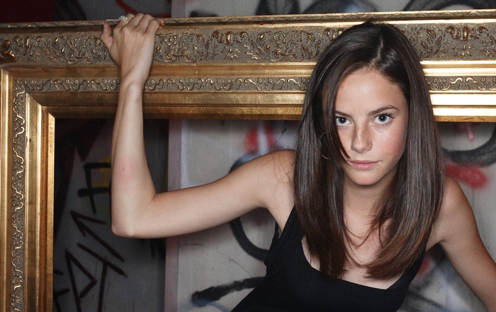 Kaya Scodelario in a golden frame