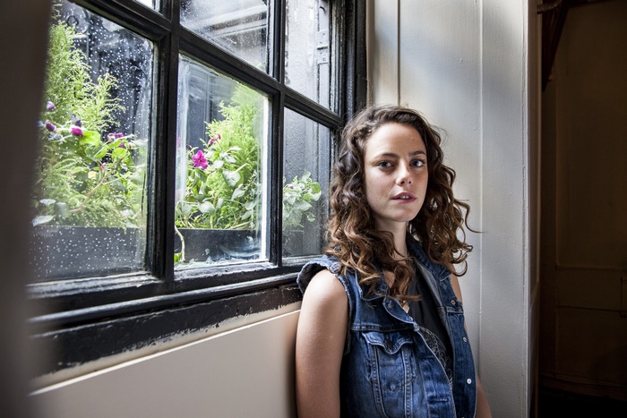 Kaya Scodelario by a window