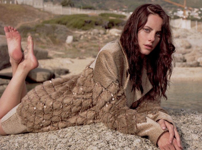 Kaya Scodelario on a rocky beach