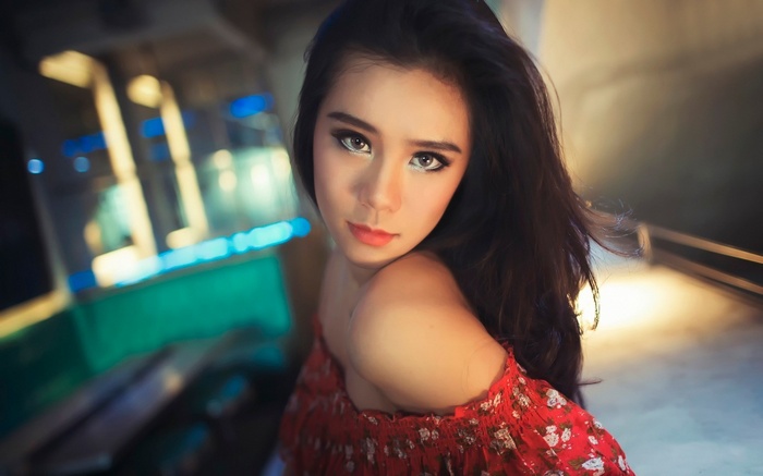 Woman in red floral top