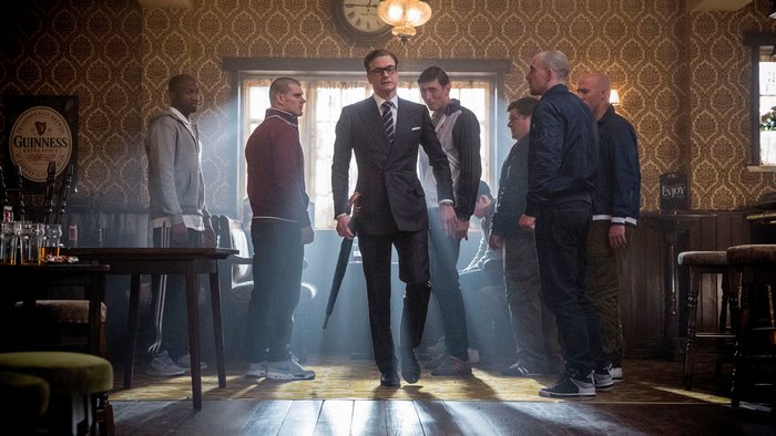 Colin Firth in a pub with a group of men