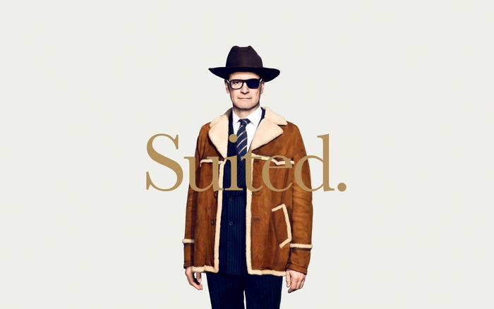 Colin Firth in a brown shearling coat and hat