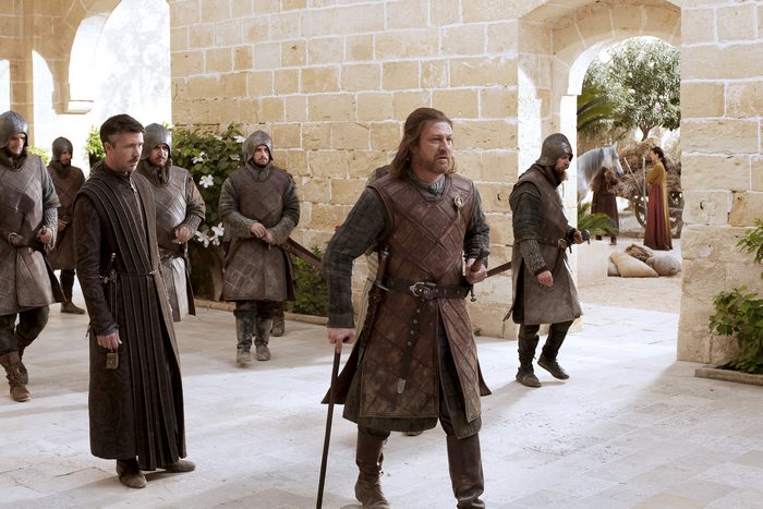 Aidan Gillen and guards in medieval armor
