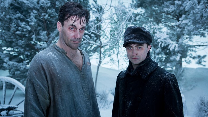 Daniel Radcliffe and Jon Hamm in a snowy forest