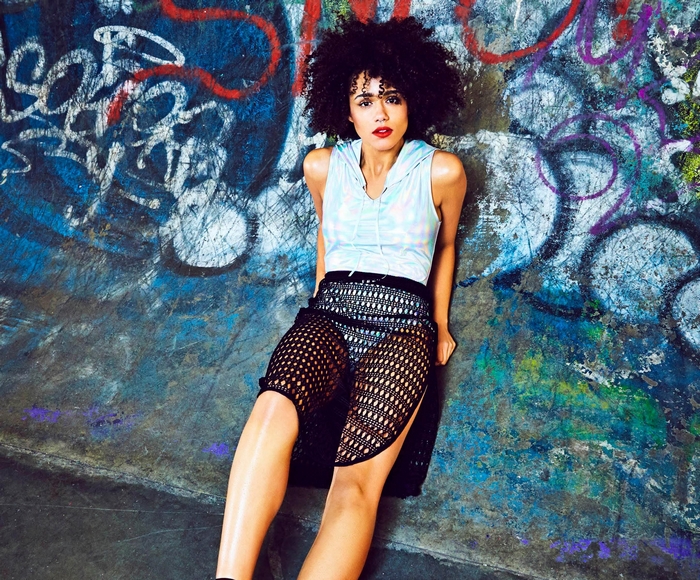Nathalie Emmanuel against graffiti wall