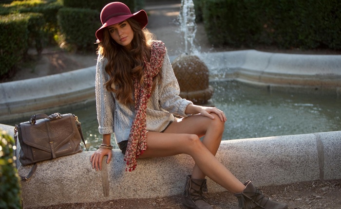 Clara Alonso sitting by a fountain