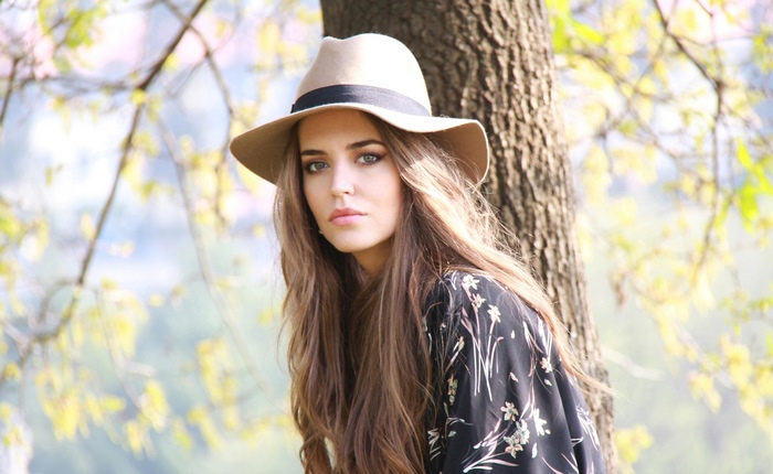 Clara Alonso wearing a hat and dress