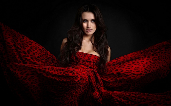 Woman in a red leopard print dress