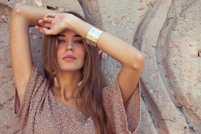 Clara Alonso posing against a rock formation