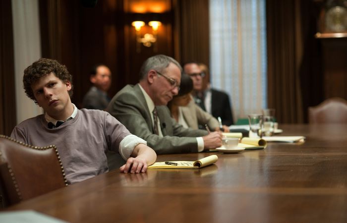 Jesse Eisenberg in a boardroom