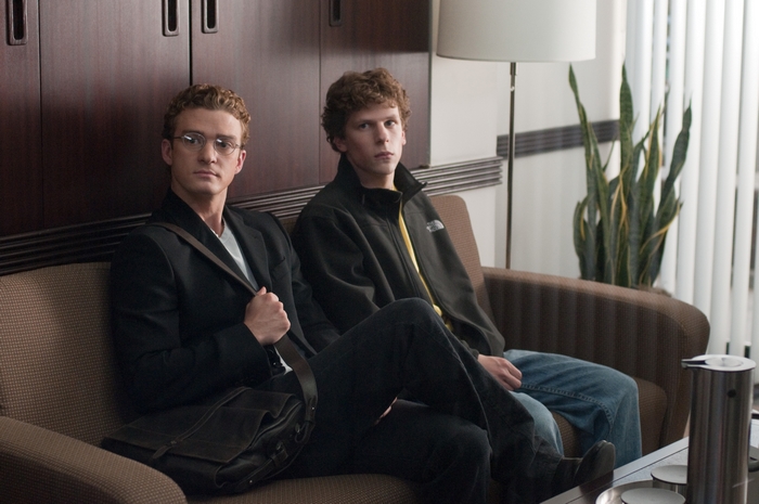 Jesse Eisenberg and Justin Timberlake sitting on a couch