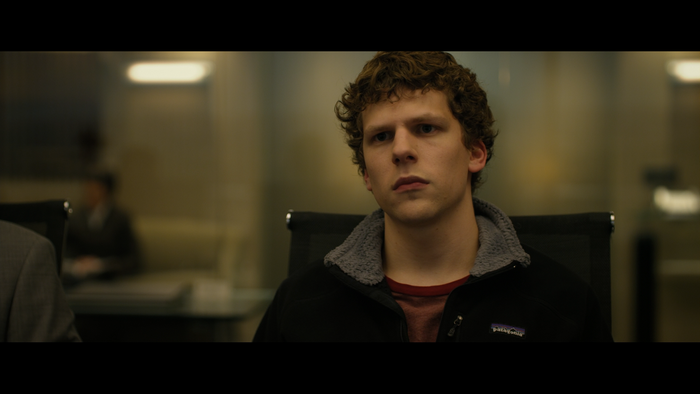 Jesse Eisenberg in a meeting