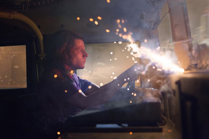 Jesse Eisenberg welding inside a vehicle