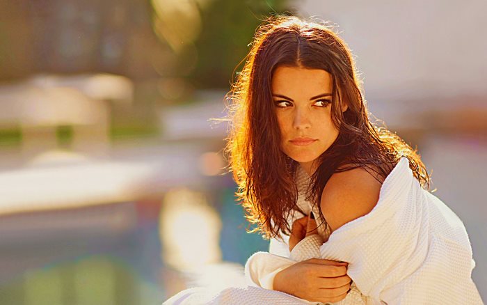 Jaimie Alexander in a white robe outdoors