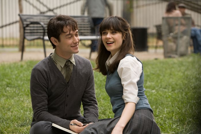 Joseph Gordon-Levitt and Zooey Deschanel sitting on grass