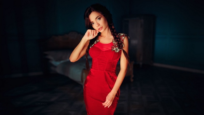 Woman in red dress with braided hair