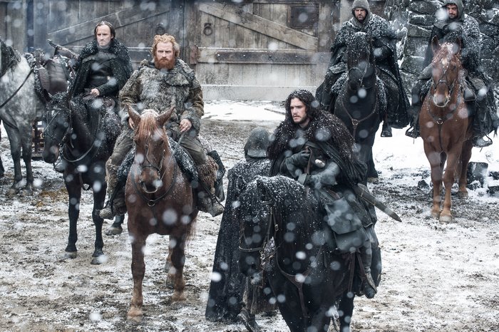 Kristofer Hivju and Jon Snow on horseback in snow