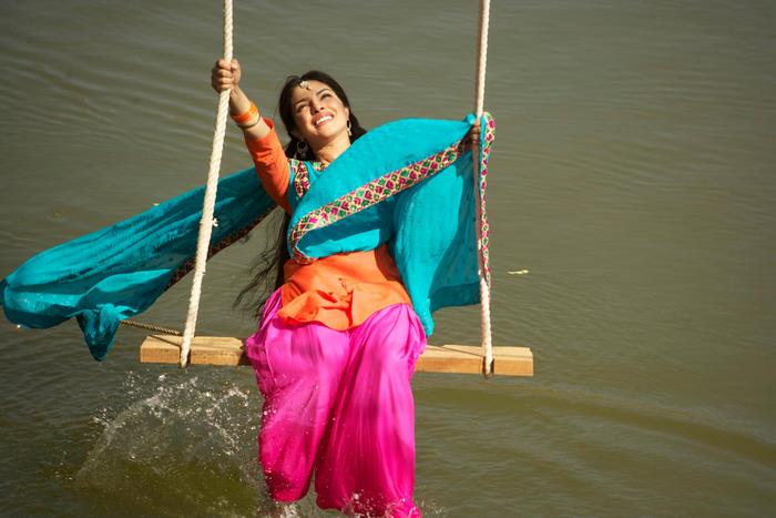 Priyanka Chopra on a swing over water