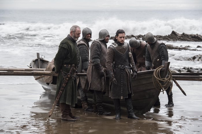 Jon Snow and soldiers with a boat on a beach