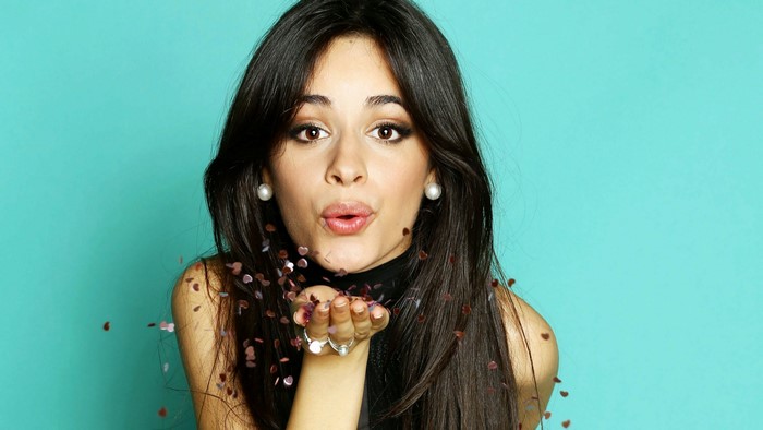 Camila Cabello Blowing Confetti on Turquoise