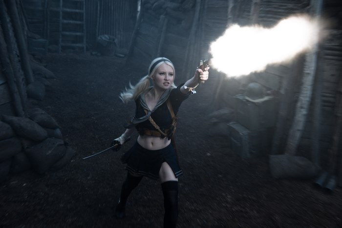 Emily Browning firing a gun