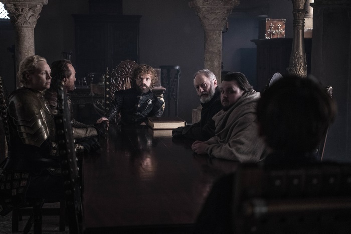 Samwell Tarly and companions in a council room