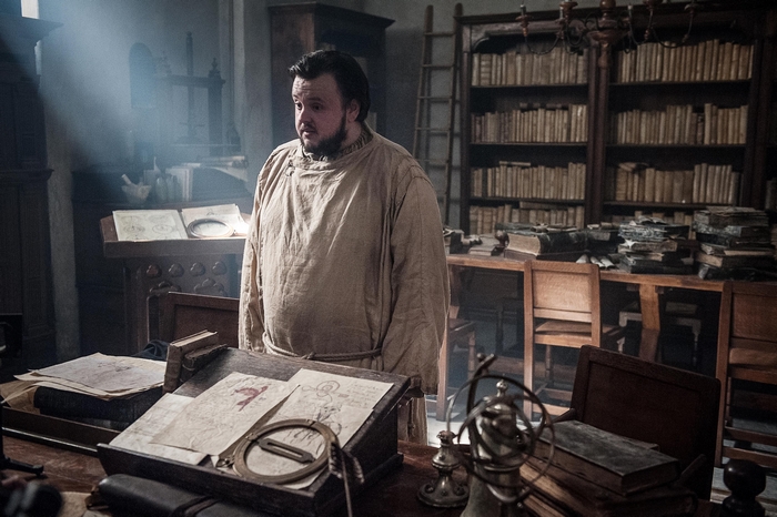 Samwell Tarly from Game of Thrones in a library