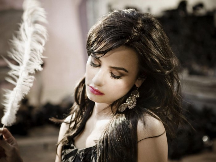 Demi Lovato with a feather