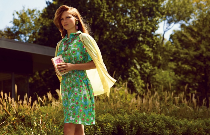 Léa Seydoux holding a book outdoors