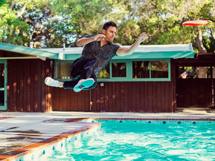 Channing Tatum jumping over a pool with a frisbee