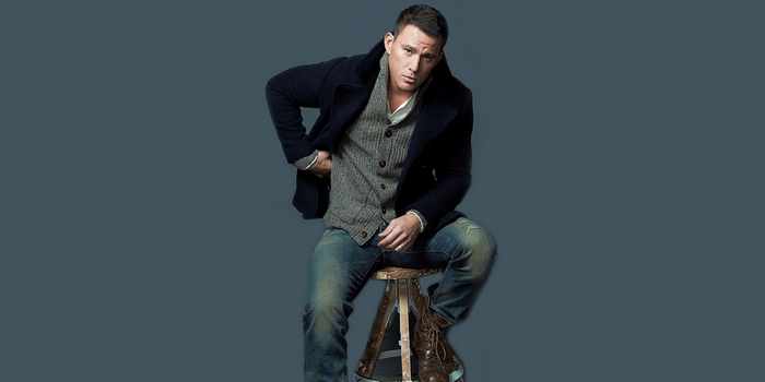 Channing Tatum sitting on a stool