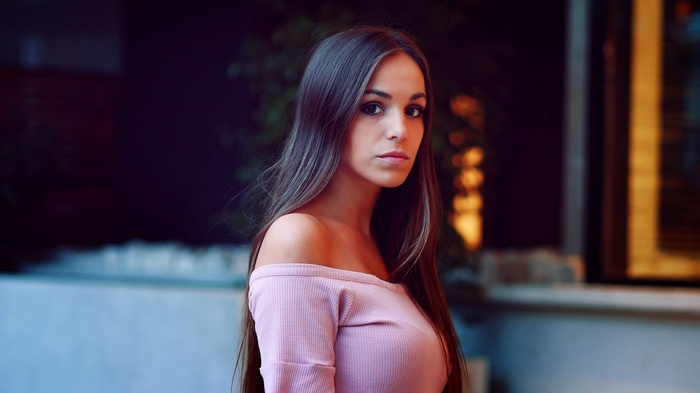 Woman in pink off-the-shoulder top