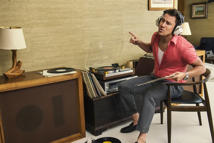 Channing Tatum with headphones and vinyl records