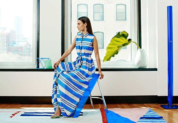 Jordana Brewster sitting on a stool